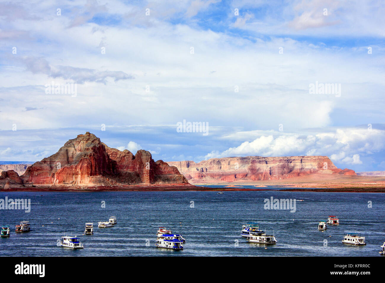 A view of Lake Powell and floating houseboats in Glen Canyon National Recreation Area Stock Photo