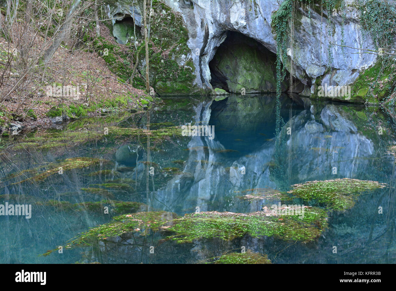 Springhead and clear, turquoise water of Krupaja river running out from the cave, Krupajsko vrelo, Serbia Stock Photo