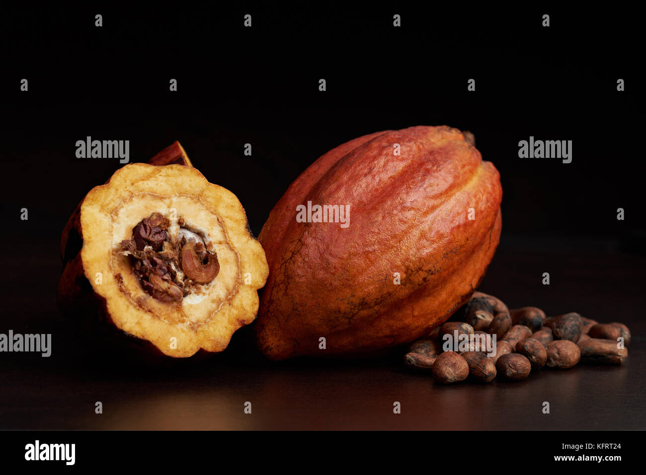 Macro of open cocoa pod on dark brown surface Stock Photo Alamy