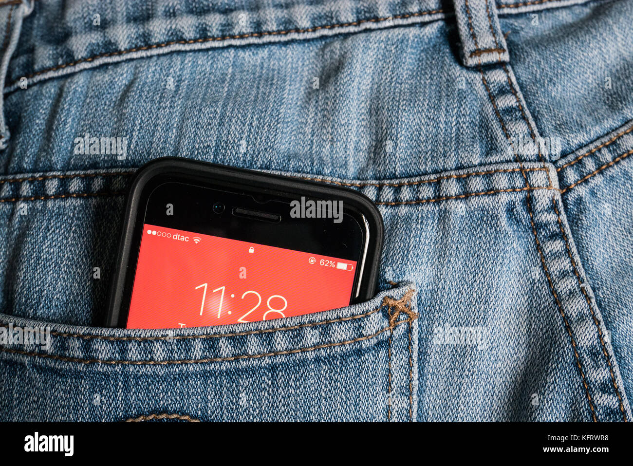 Bangkok, Thailand - October 31, 2017 : Apple iPhone 7 in a jeans pocket. Stock Photo