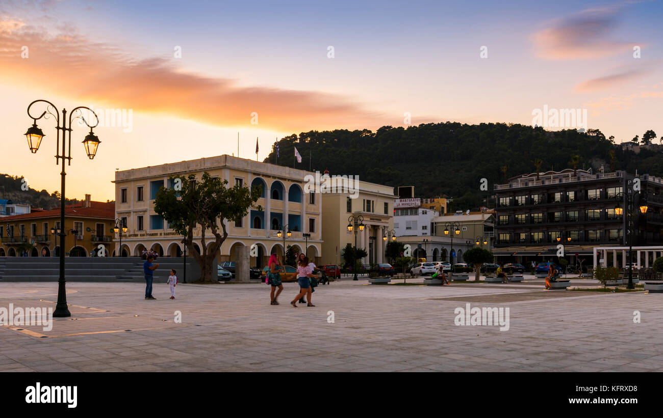 People in front of the town hall in Solomos square in Zakynthos town, Greece. Stock Photo