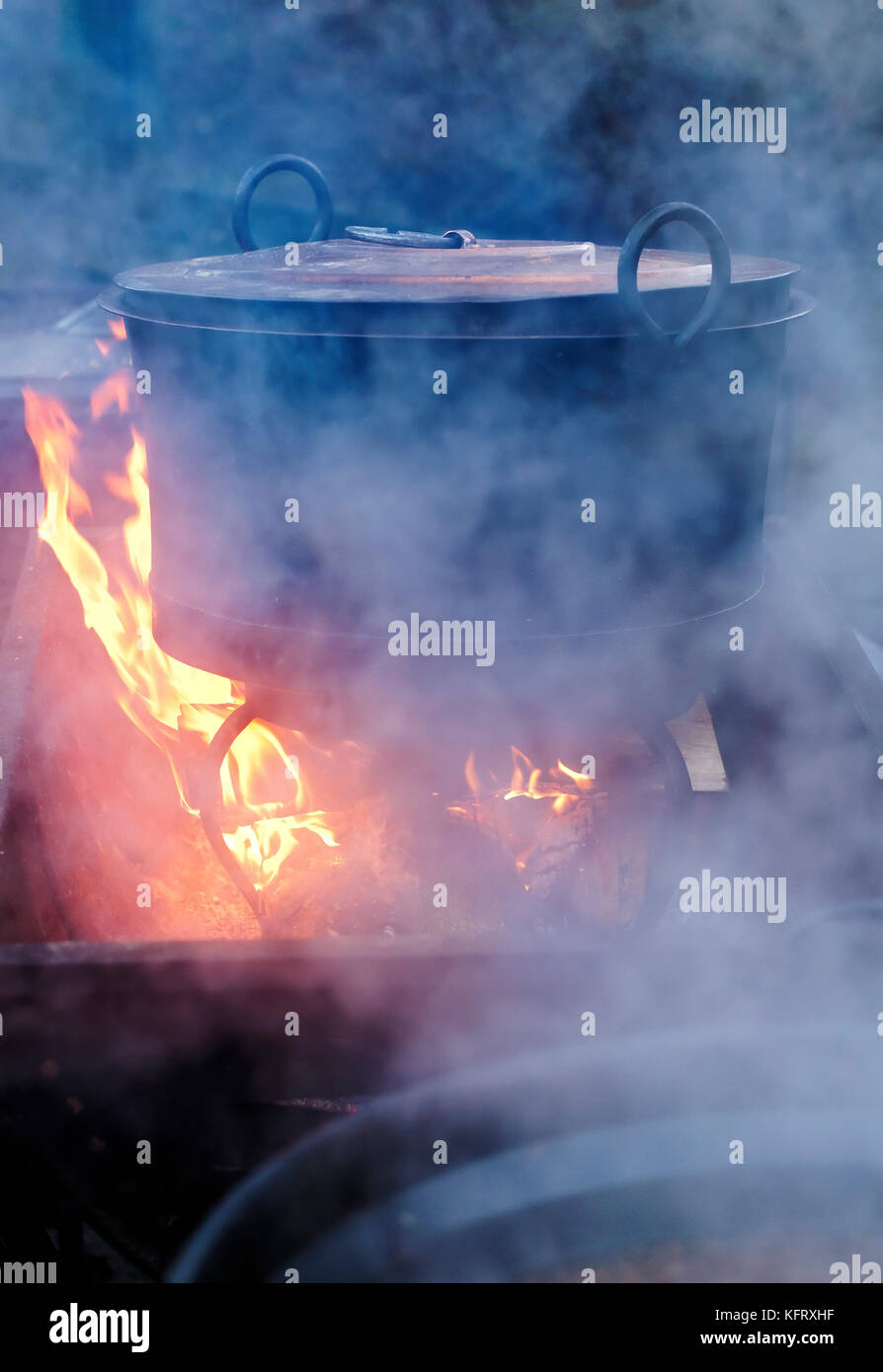 Preparing food on fire Stock Photo Alamy