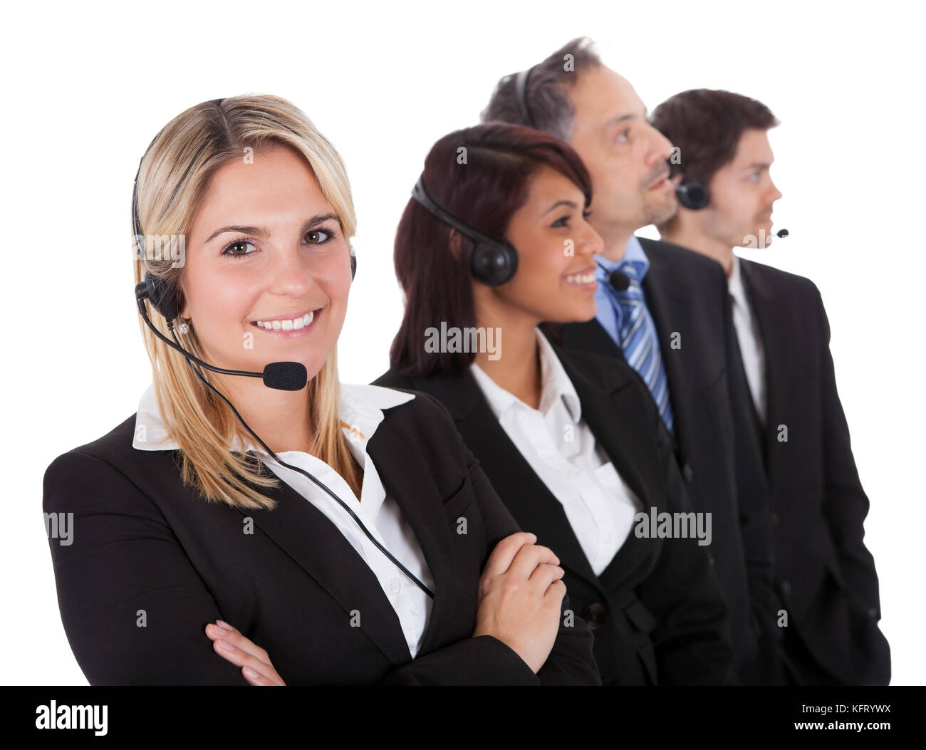 Confident business team with headset standing in a line against white background Stock Photo