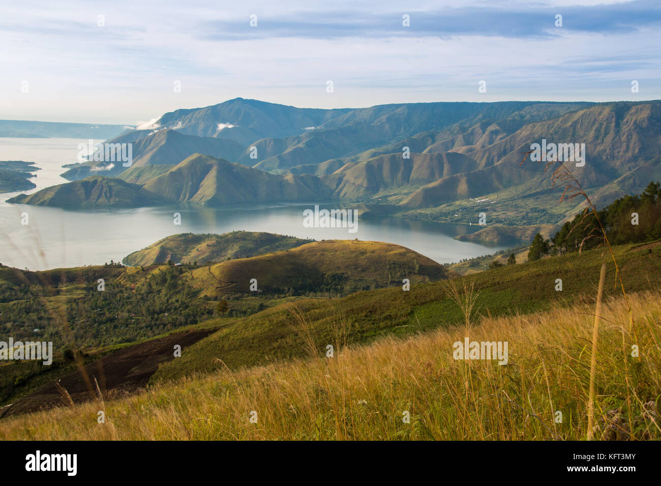 lake toba is a large natural lake occupying the caldera of a supervolcano, in the middle of the northern part of the Indonesian island of Sumatera. Stock Photo