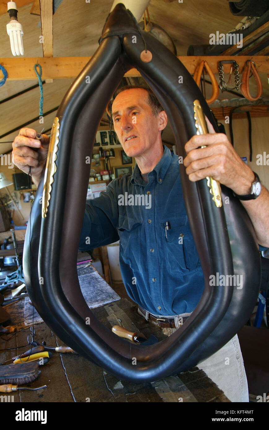Terry Davis, maker of horse collars, saddles and harness at his workshop in Shropshire Stock Photo