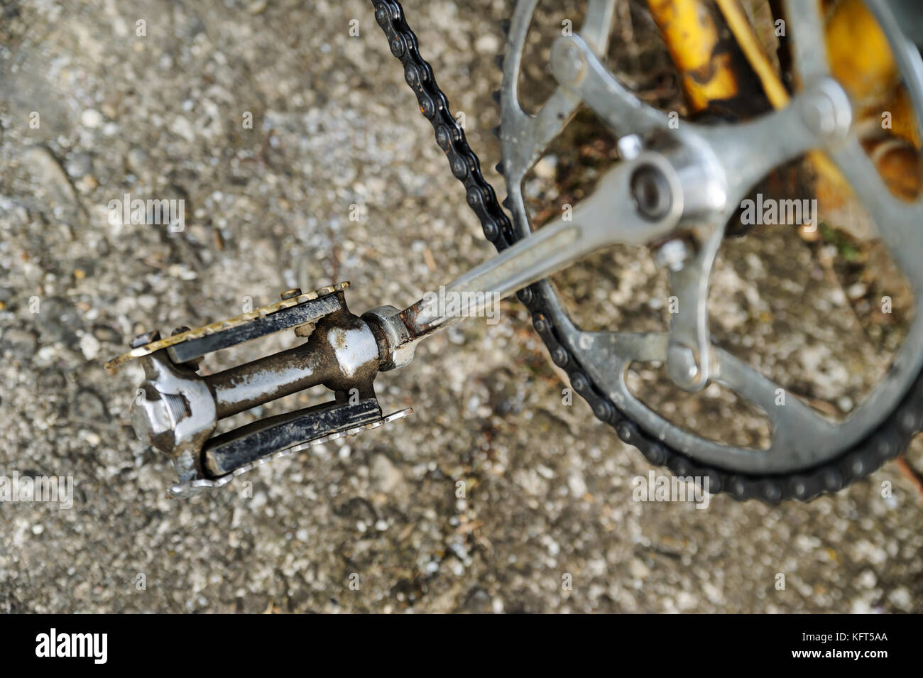 Old metal bicycle pedal. Pedal with gears and chain. Top view. Stock Photo