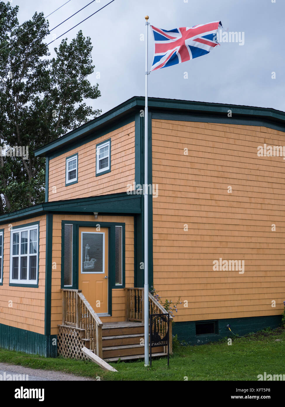 House with Union Jack flying, Woody Point, Newfoundland, Canada Stock