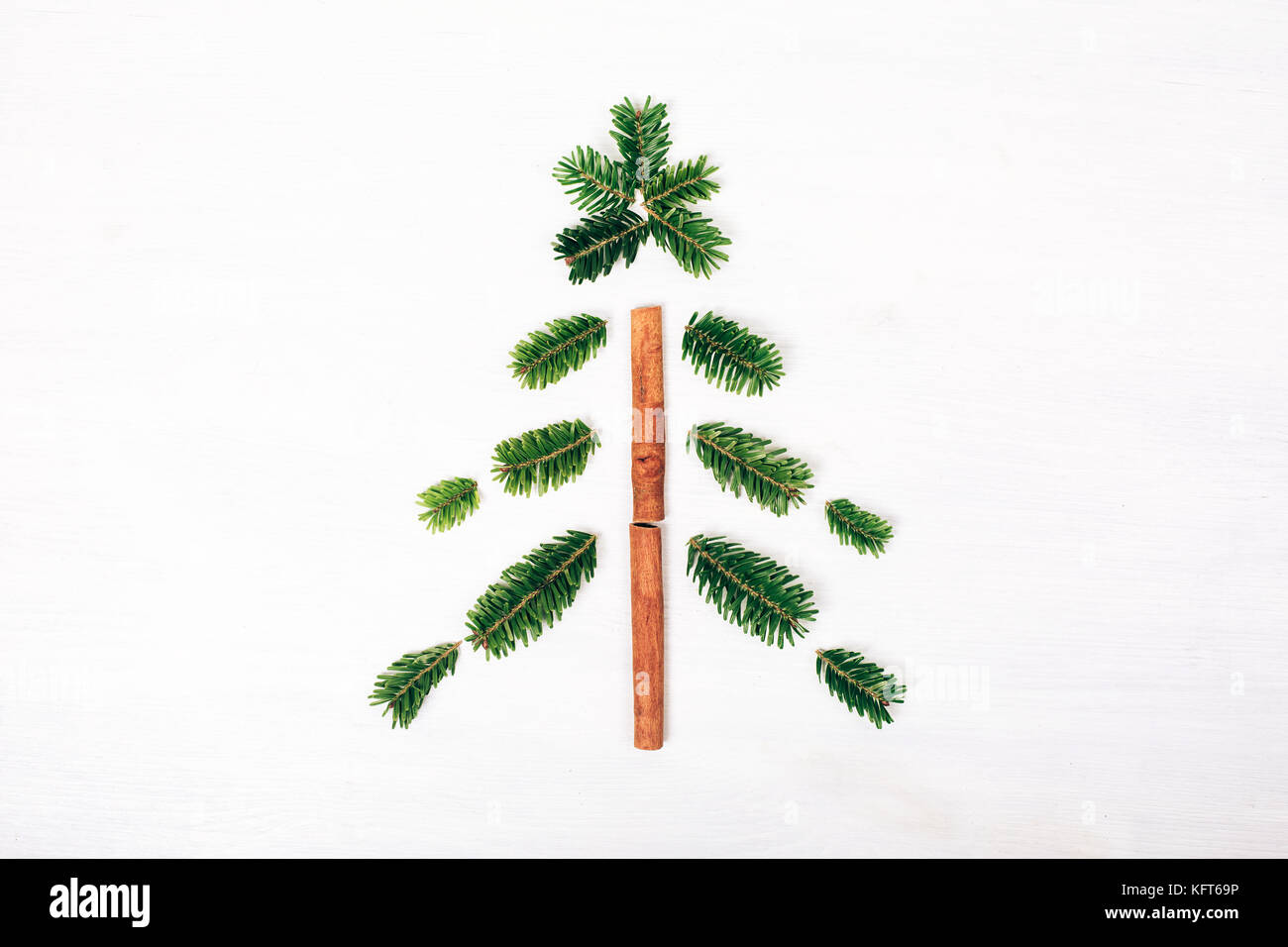 Christmas tree made of fir branches. White wooden rustic background ...