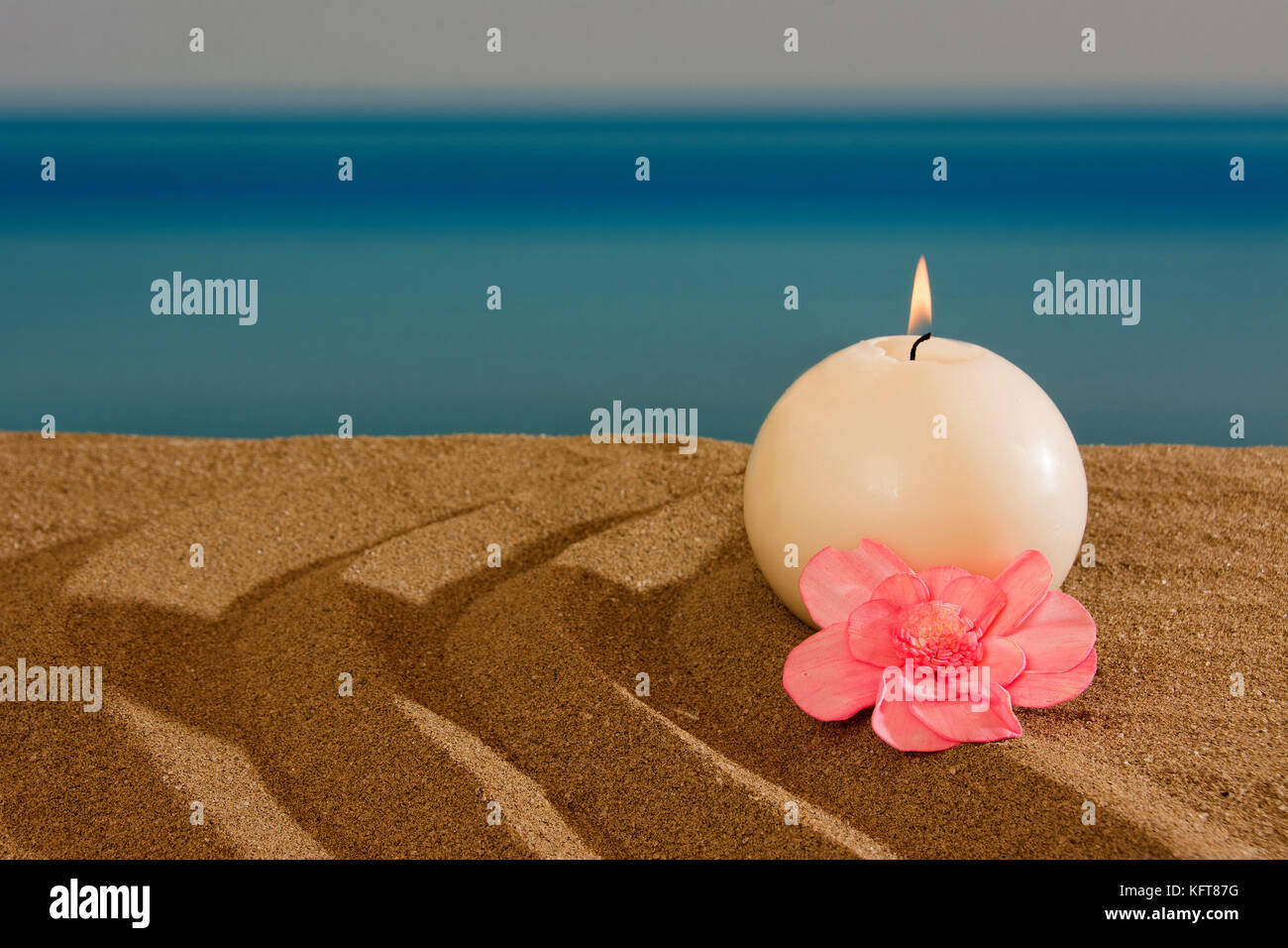 Candle on the beach, relaxation concept Stock Photo Alamy