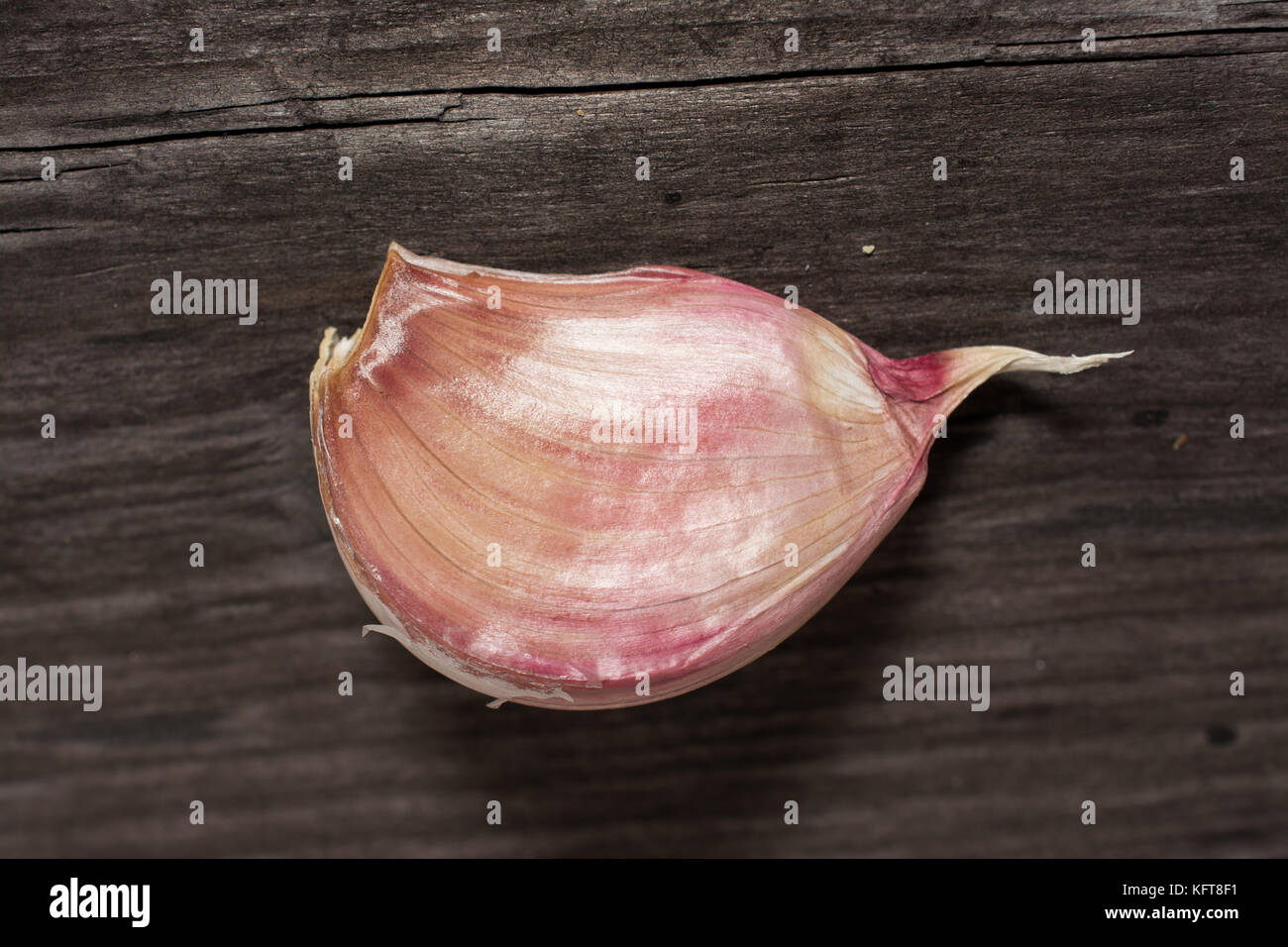 Garlic cloves on wooden vintage background Stock Photo - Alamy