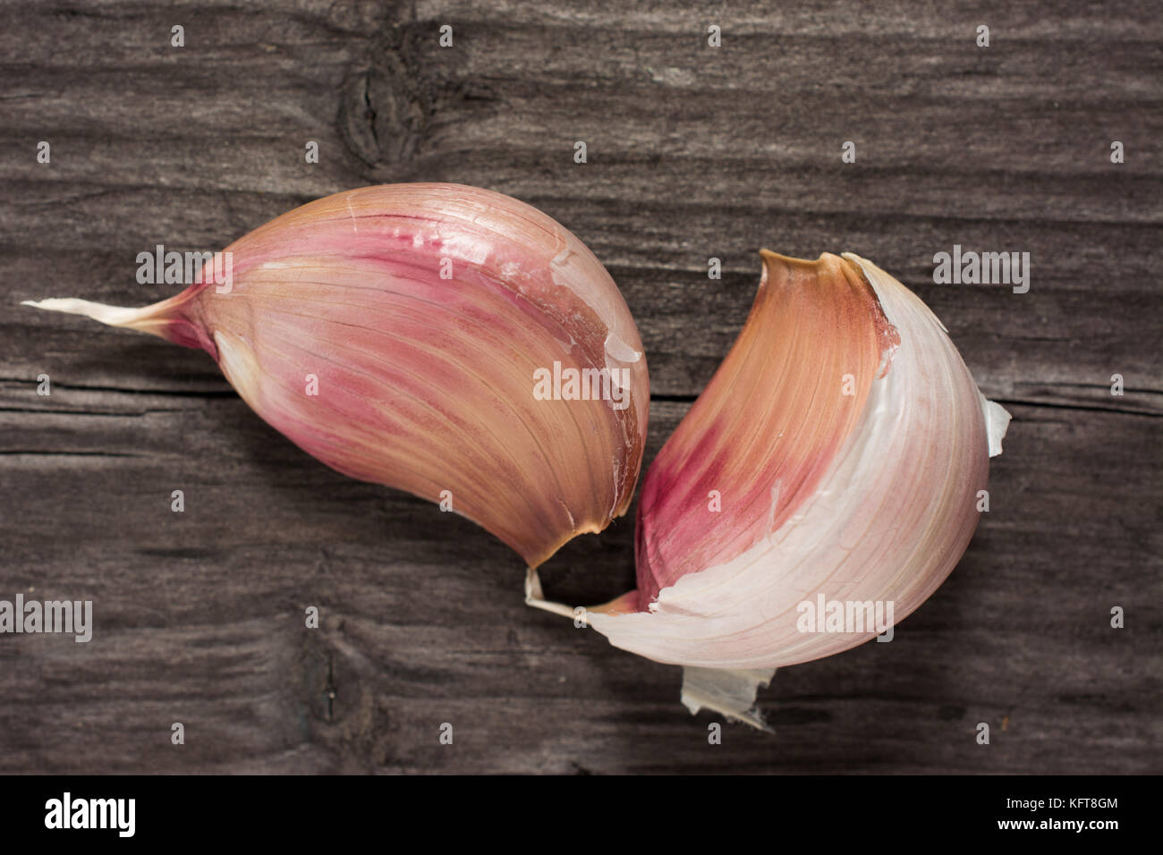 Garlic cloves on wooden vintage background Stock Photo - Alamy