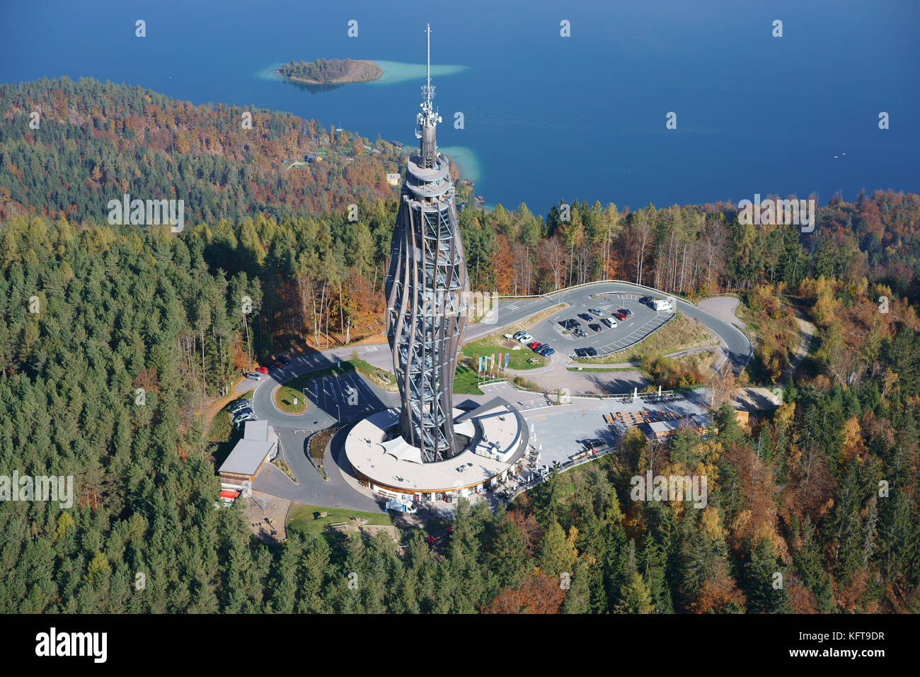 AERIAL VIEW. Futuristic wooden tower used for observation and television transmission (height: 100m). Pyramidenkogel, Wörthersee, Carinthia, Austria. Stock Photo