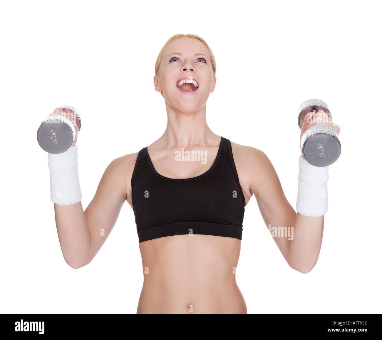 Beautiful young fitness woman doing weight training. Isolated on white Stock Photo