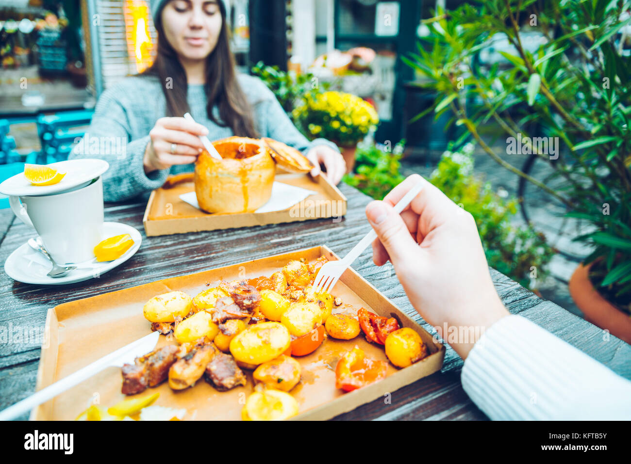 couple eating in cafe outside Stock Photo