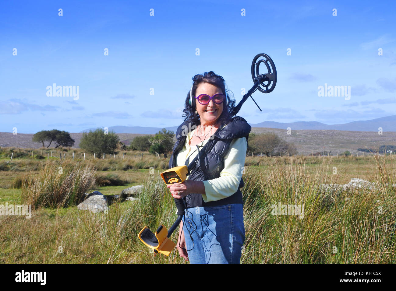 Mature female metall detecting, Ireland John Gollop Stock Photo Alamy