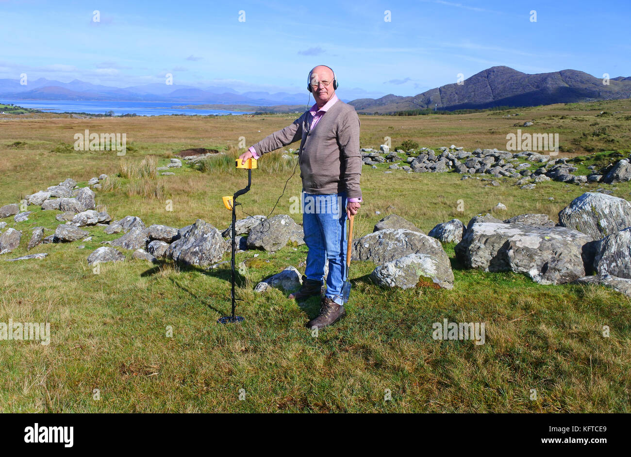 Mature male metal detecting in an Irish Landscape John Gollop Stock