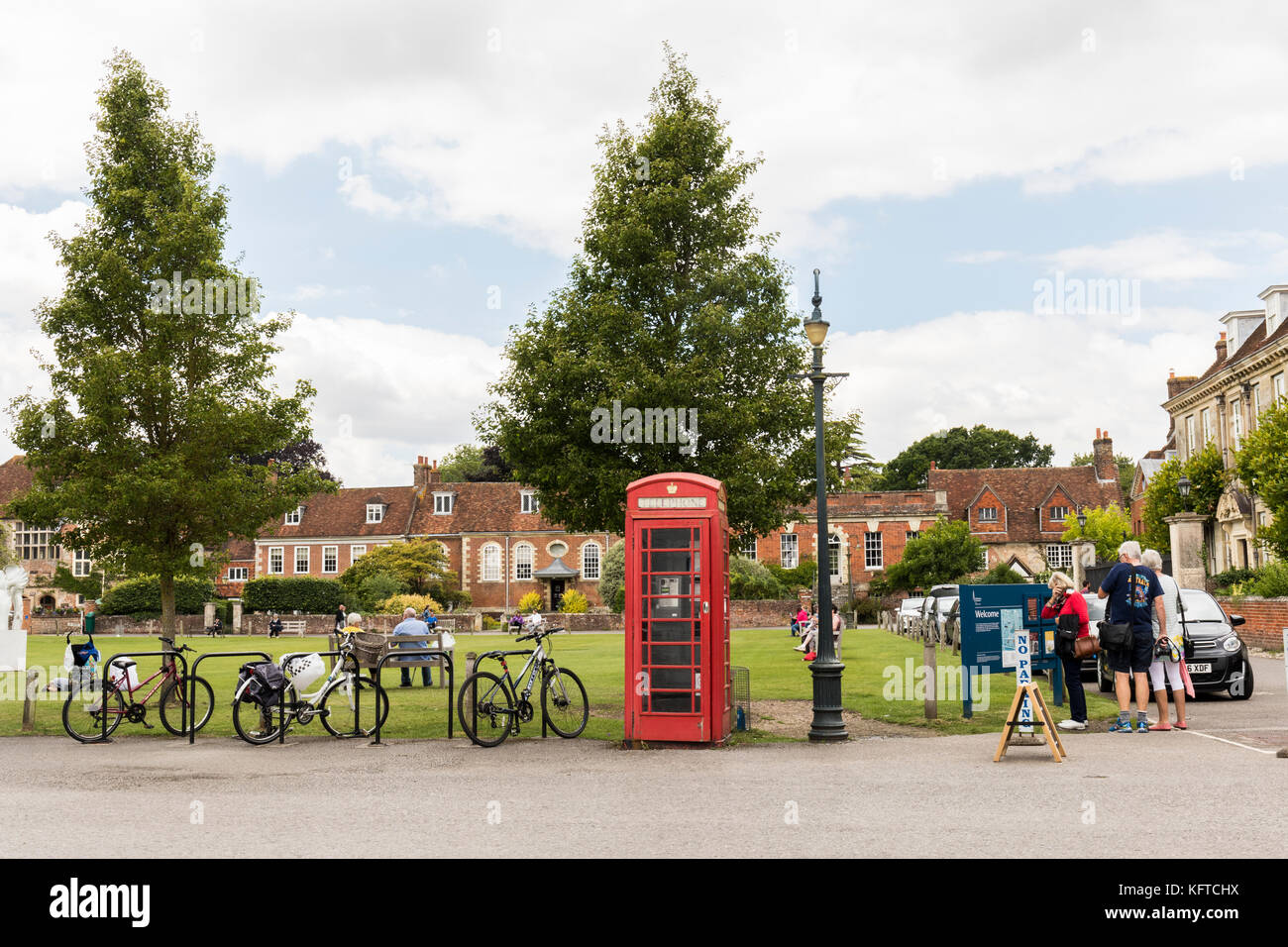 Salisbury Cathedral green with its red telephone box and old green lamp post. Wiltshire, England, UK Stock Photo