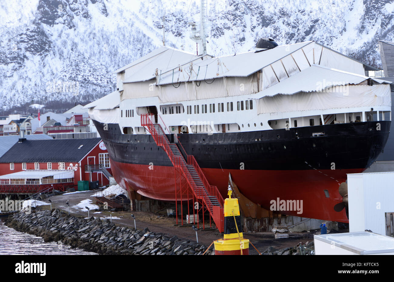 The Hurtigruten Museum  and the Hurtigruten ship M/S Finnmarken in Stokmarknes in  winter.  Stokmarknes, Nordland, Norway. Stock Photo