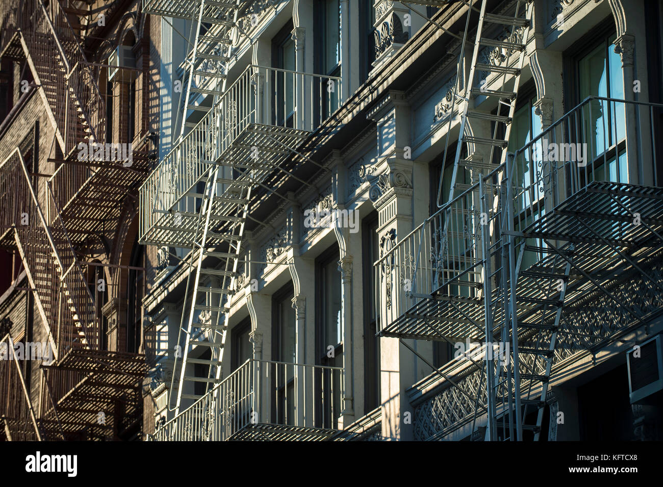 Architectural detail view of cast iron fire escapes in New York City