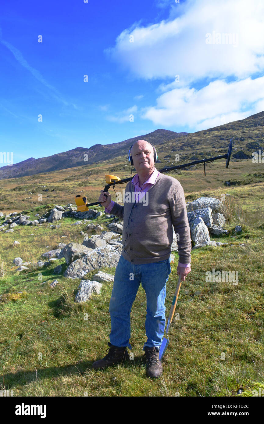 Mature male metal detecting in an Irish Landscape John Gollop Stock
