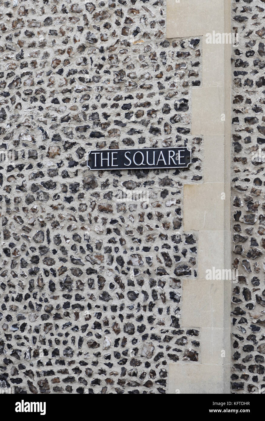 Sign saying ‘The Square’ in a flint and sandstone wall. Winchester, Hampshire, England, UK., Stock Photo