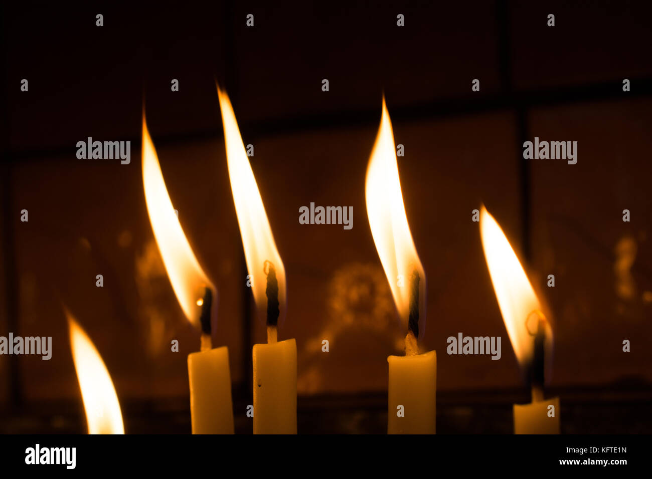 Burning candles with candle light in the dark Stock Photo Alamy