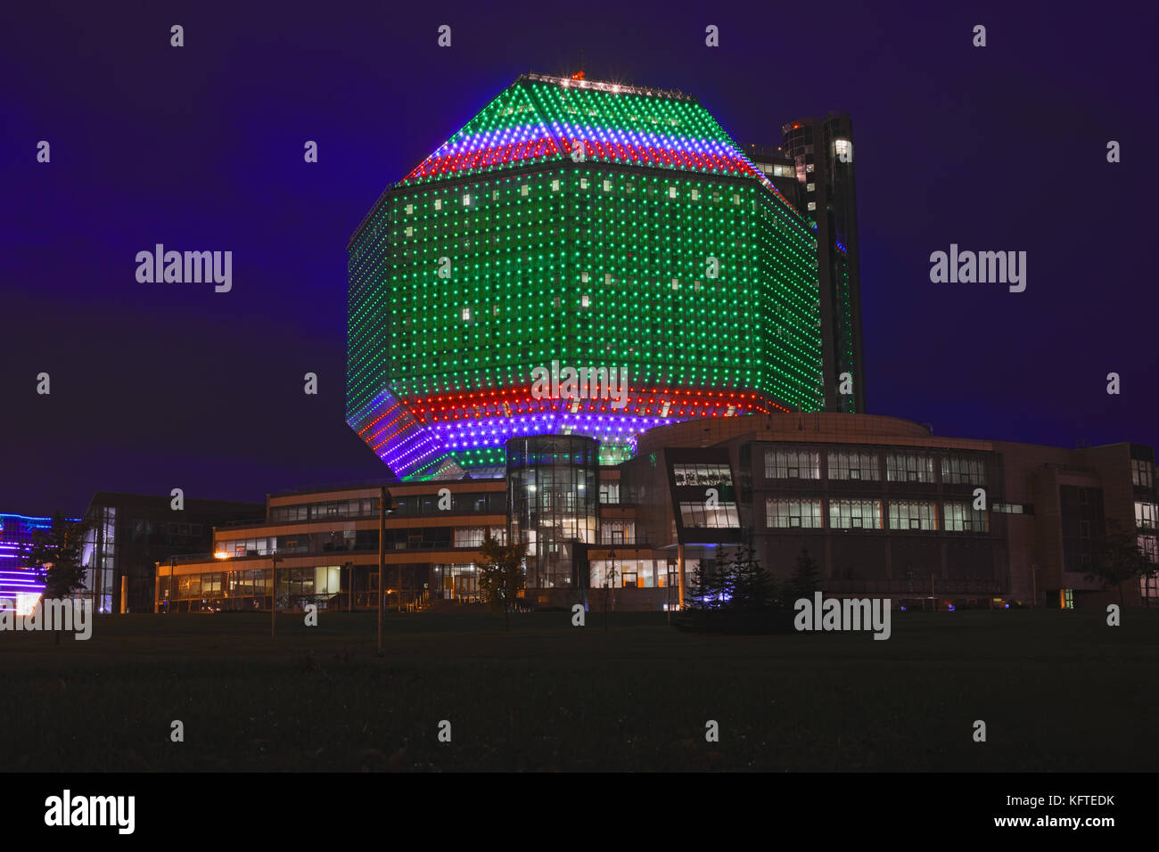 National Library of Belarus in Minsk. Unique modern building, main universal library in evening. Symbol of Belarusian culture and science Night illumi Stock Photo