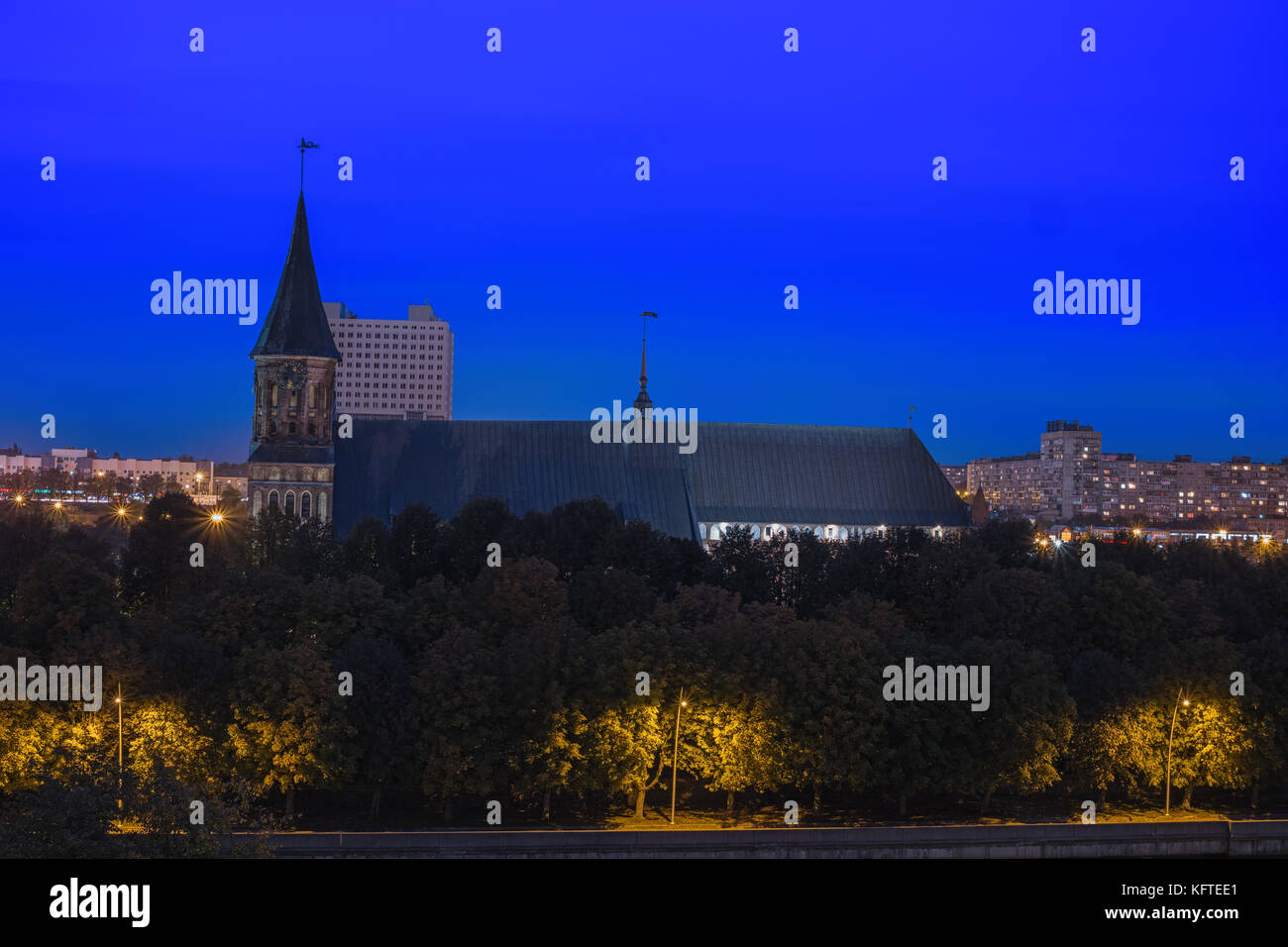 Night cityscape of Kaliningrad, Russia. Gothic cathedral in Kaliningrad city, formerly Koenigsberg, Germany. Beautiful view of Kant Island. Night illu Stock Photo