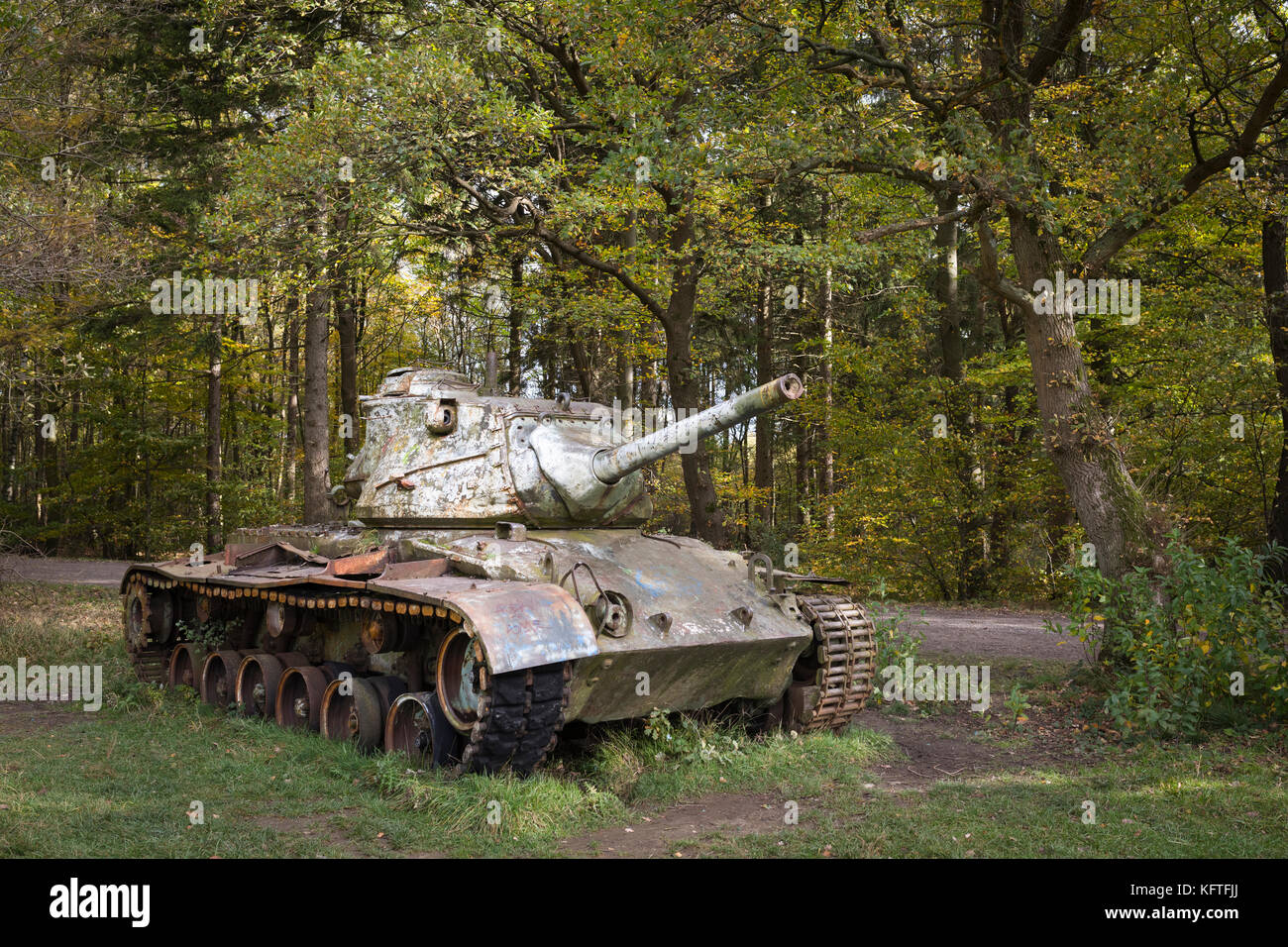 Dumped historical M47 Patton tank left behind in forest in Germany Stock Photo