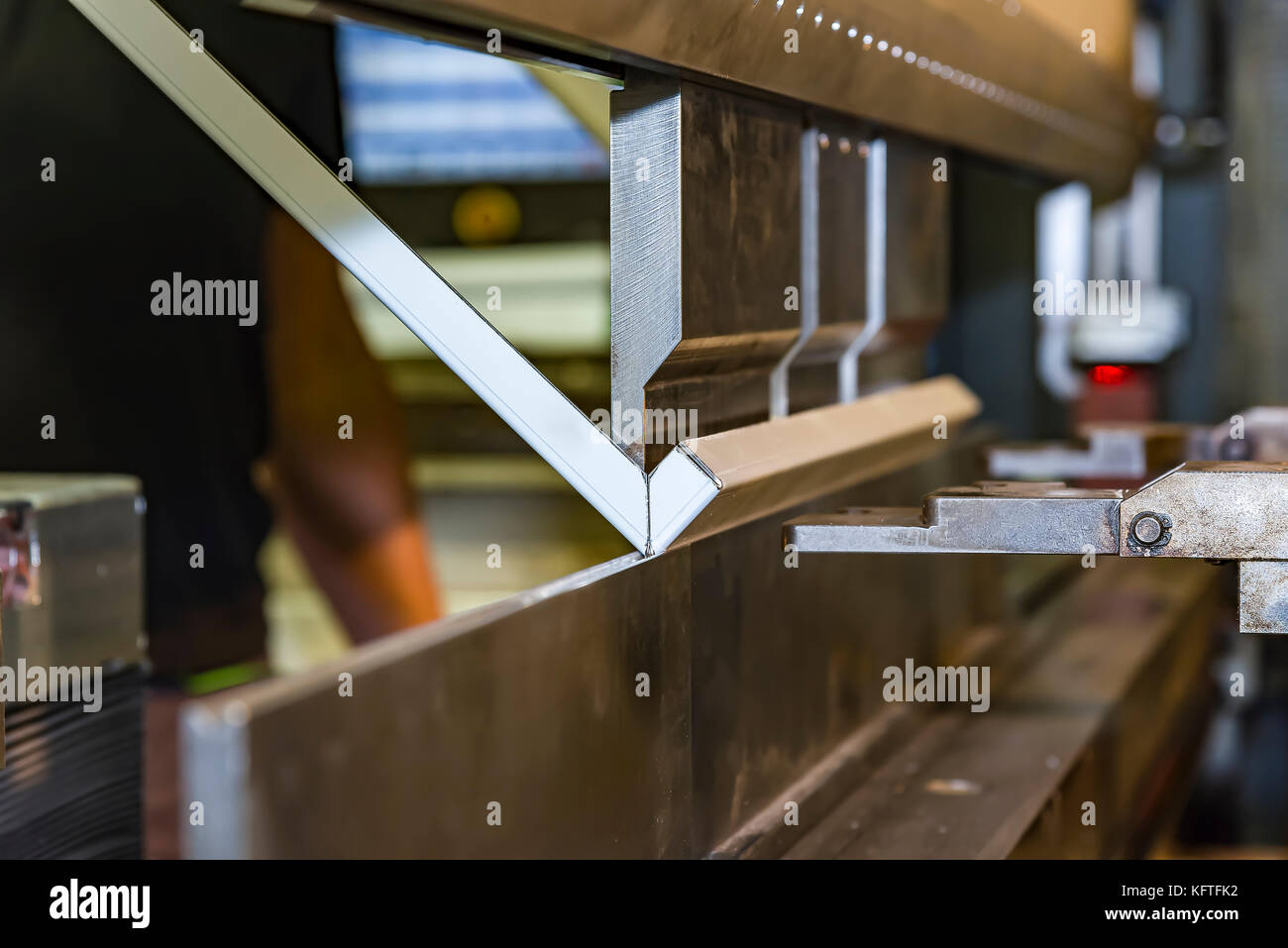 worker operating metal press machine at workshop Stock Photo - Alamy