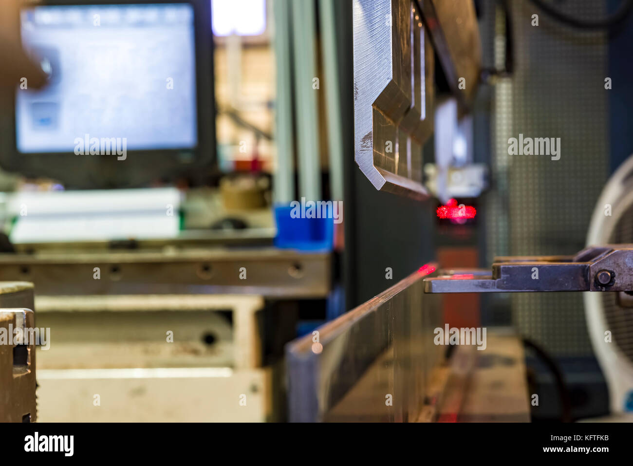 worker operating metal press machine at workshop Stock Photo - Alamy