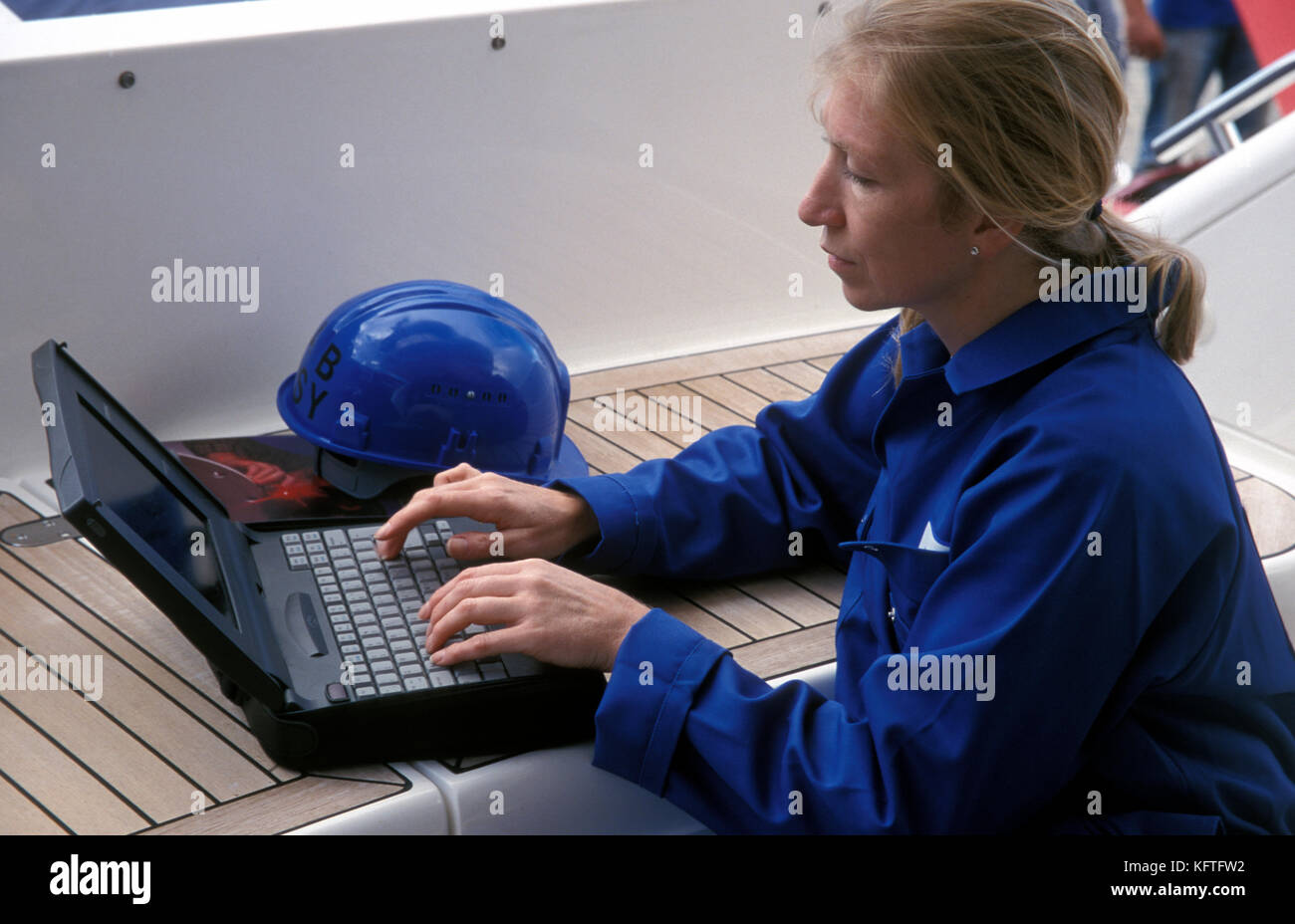 female marine engineer on laptop Stock Photo