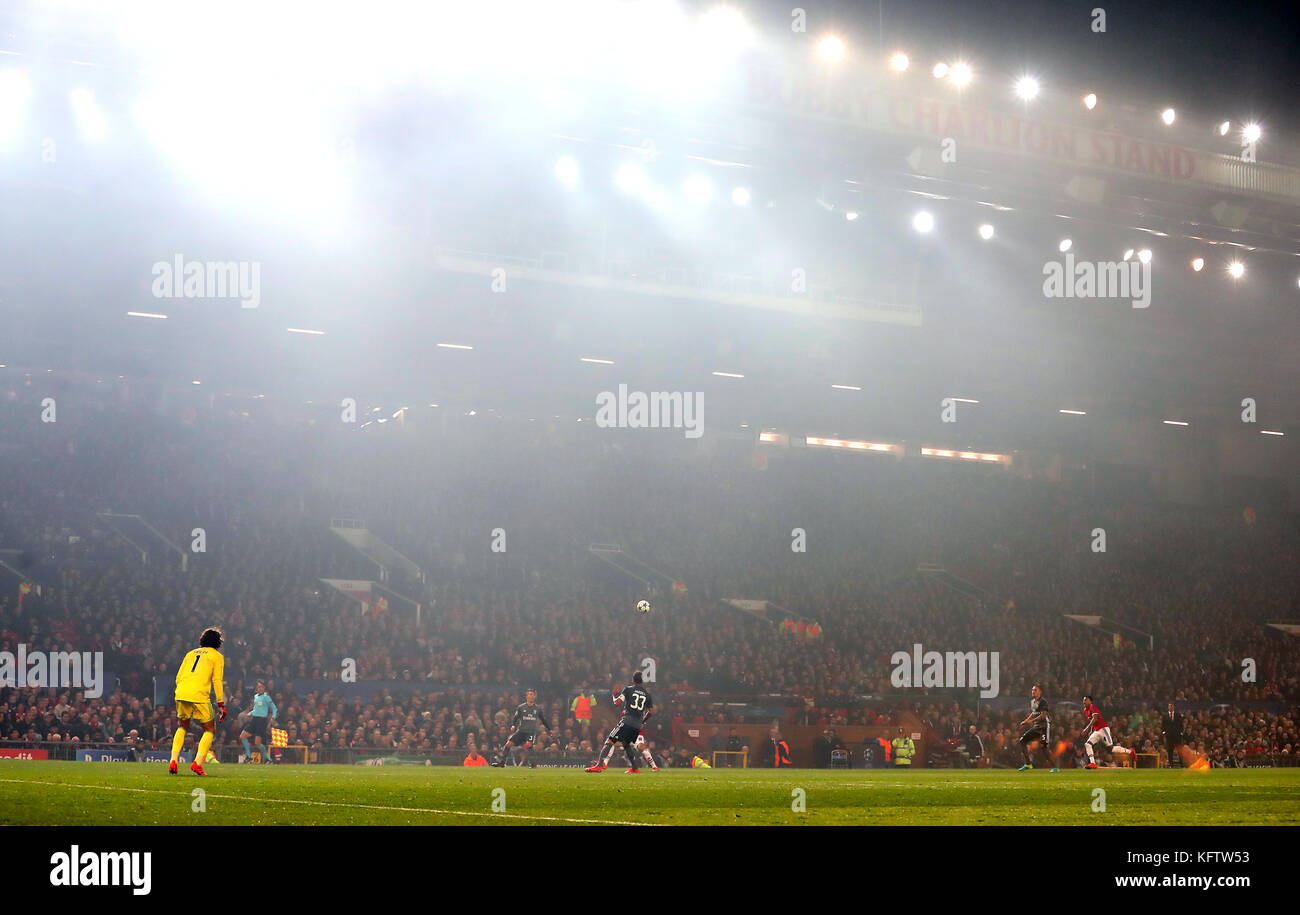 Smoke from a flare fills the stadium during the UEFA Champions League,  Group A match at Old Trafford, Manchester Stock Photo - Alamy