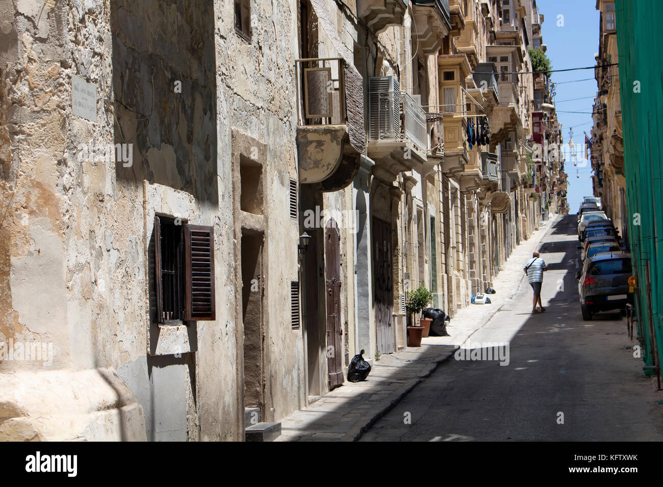 One of the old, historical streets in Valletta / Malta. Image shows architectural style of the city and lifestyle. It's the capital of the Mediterrane Stock Photo