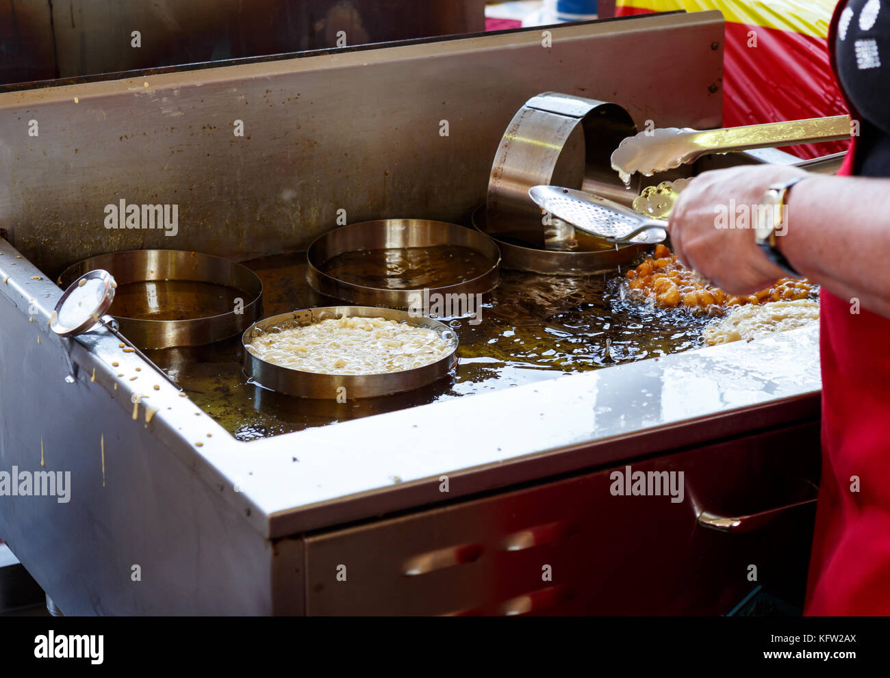 Deep frying funnel cake Stock Photo Alamy