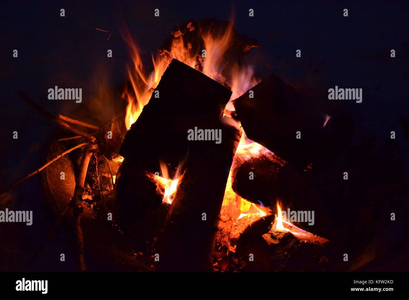 Night time campfire in dark background Stock Photo