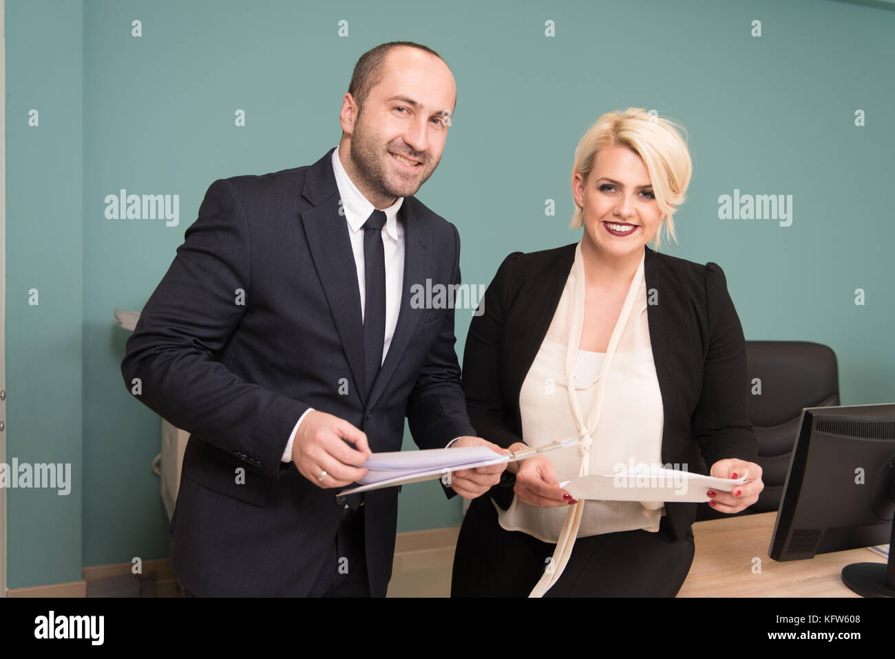 Happy Young Business Man And Woman Work In Modern Office On Computer ...