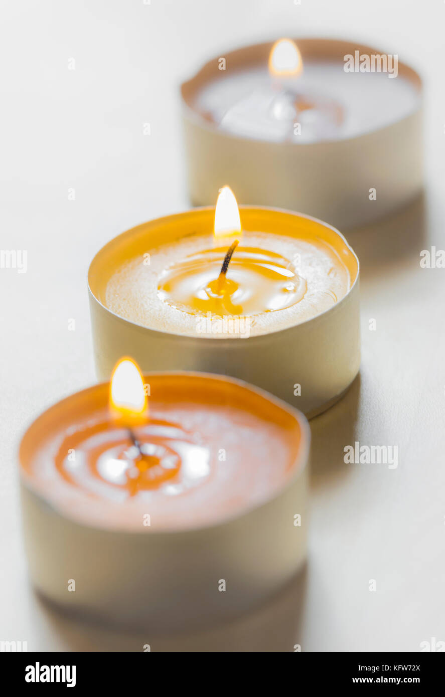 burning tealights with soft lights background Stock Photo Alamy