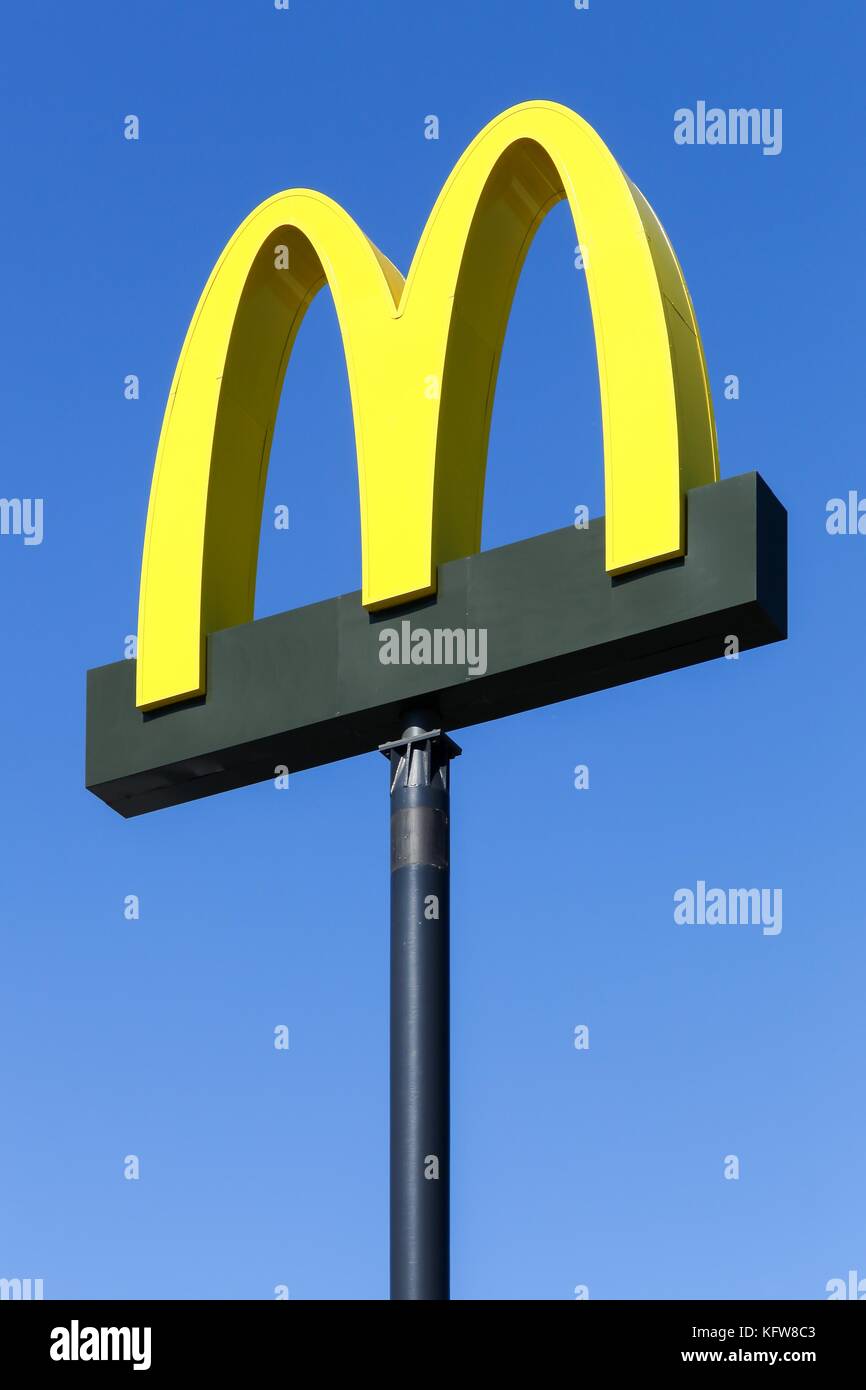 Randers, Denmark - August 19, 2015: McDonald's logo on a pole. McDonald's is the world's largest chain of hamburger fast food restaurants Stock Photo