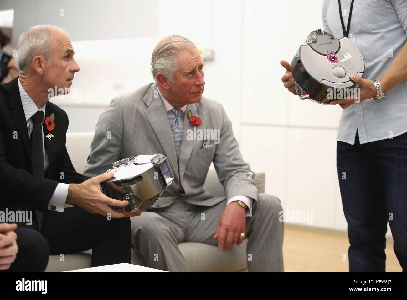 Dyson CEO Jim Rowan (left) shows the Prince of Wales a few of current projects during a tour of the Dyson Centre in Singapore - Alamy