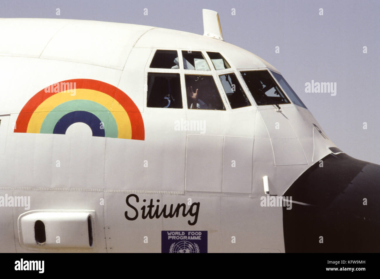 Khartoum, Sudan - September 1986 - A $1 million food airlift relief project for famine victims in war-ravaged southern Sudan “Operation Rainbow”, is tied up in red tape due to wrangling by opposing political considerations between the Sudanese government and the rebel-held areas.  The chartered C-130 Hercules aircraft prepares to deliver 210 tons of food a week with two flights daily to stem off starvation and malnutrition, sponsored by the United Nations, the Netherlands, the United States, Canada, the United Nations Children’s Fund and the World Food Program.  Staffan D. De Mistura (khaki ja Stock Photo