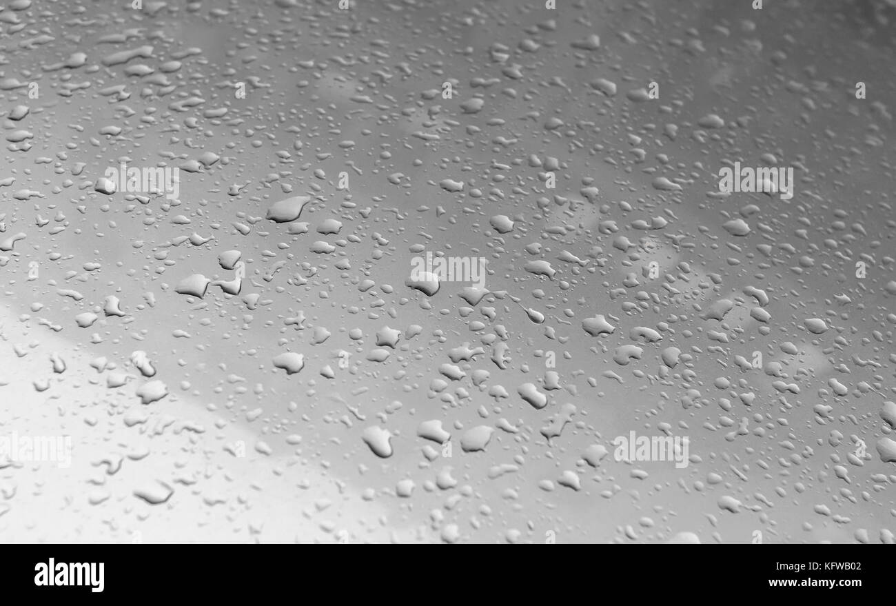 Raindrops on the hood of the car. Stock Photo