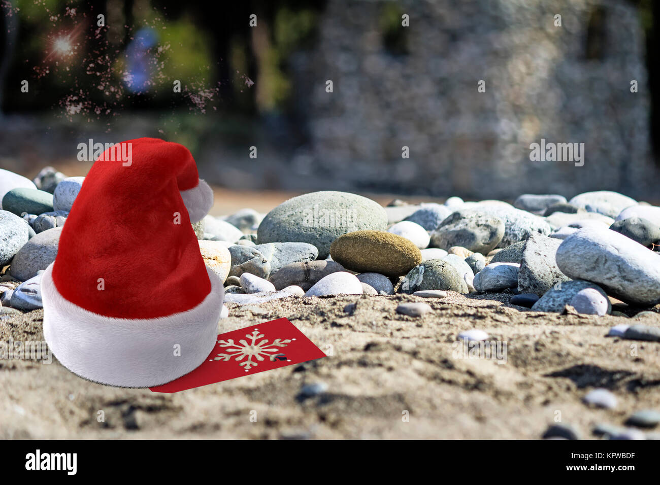 Christmas on the beach: near the sea pebbles on the beach is a Santa ...
