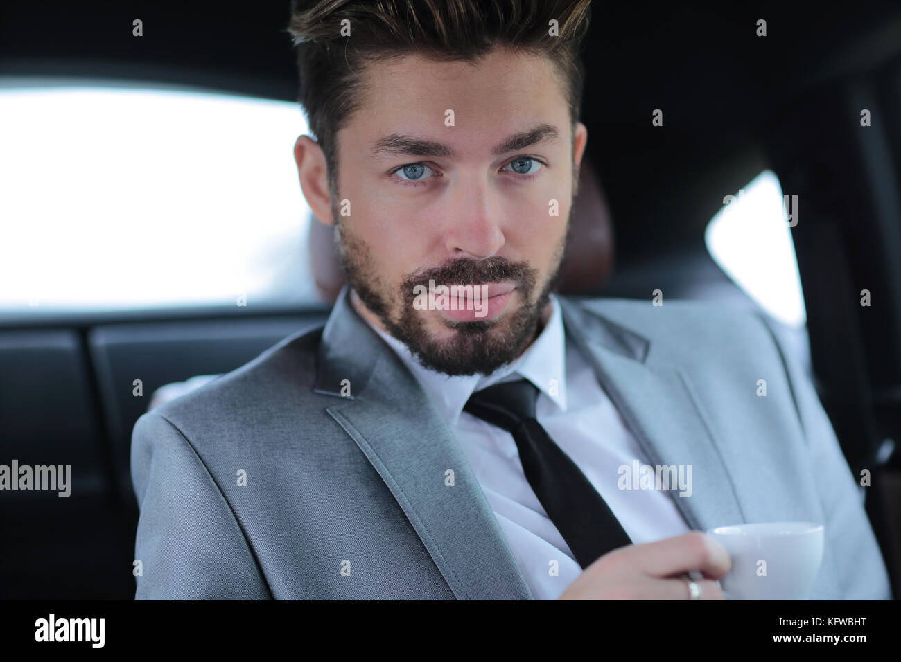 Portrait of an handsome business man driving his car Stock Photo - Alamy