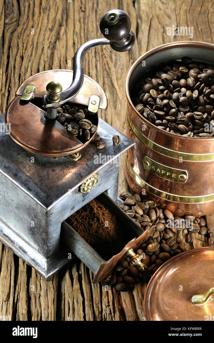Old coffee grinder, coffee maker and roasted coffee beans isolated on white  background Stock Photo - Alamy