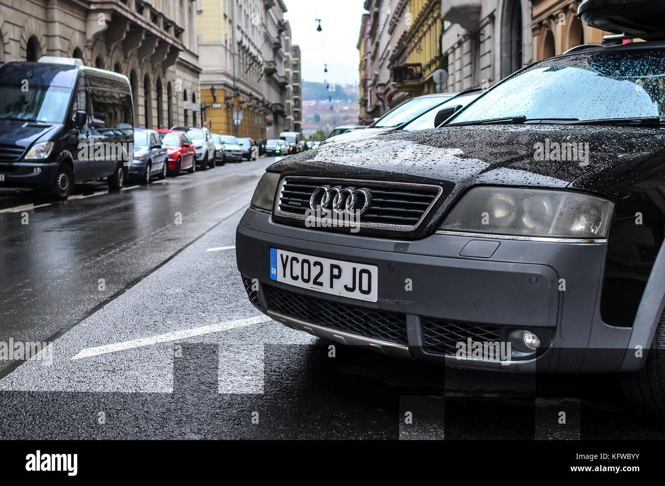 Cars in the street parking on a rainy day Stock Photo - Alamy