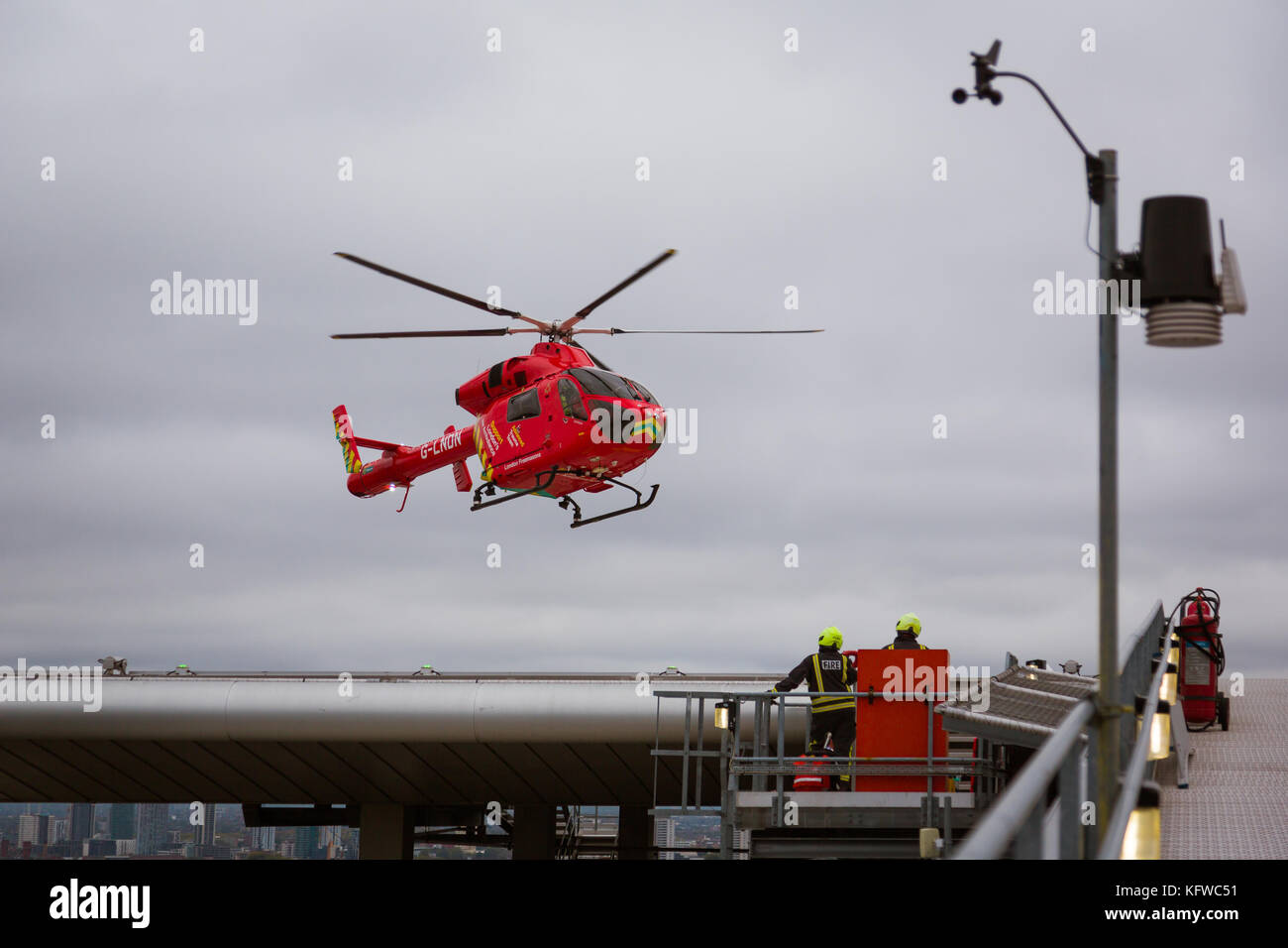 London Air Ambulance lands on the helipad of the Royal London Hospital Stock Photo