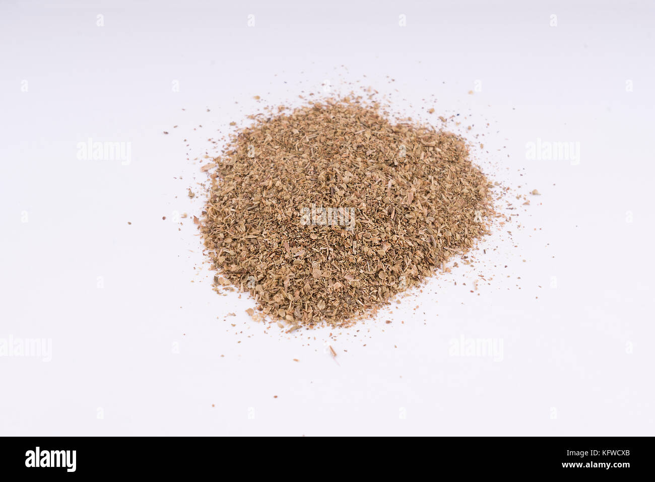 Oregano desiccated leaves on a white table background Stock Photo Alamy