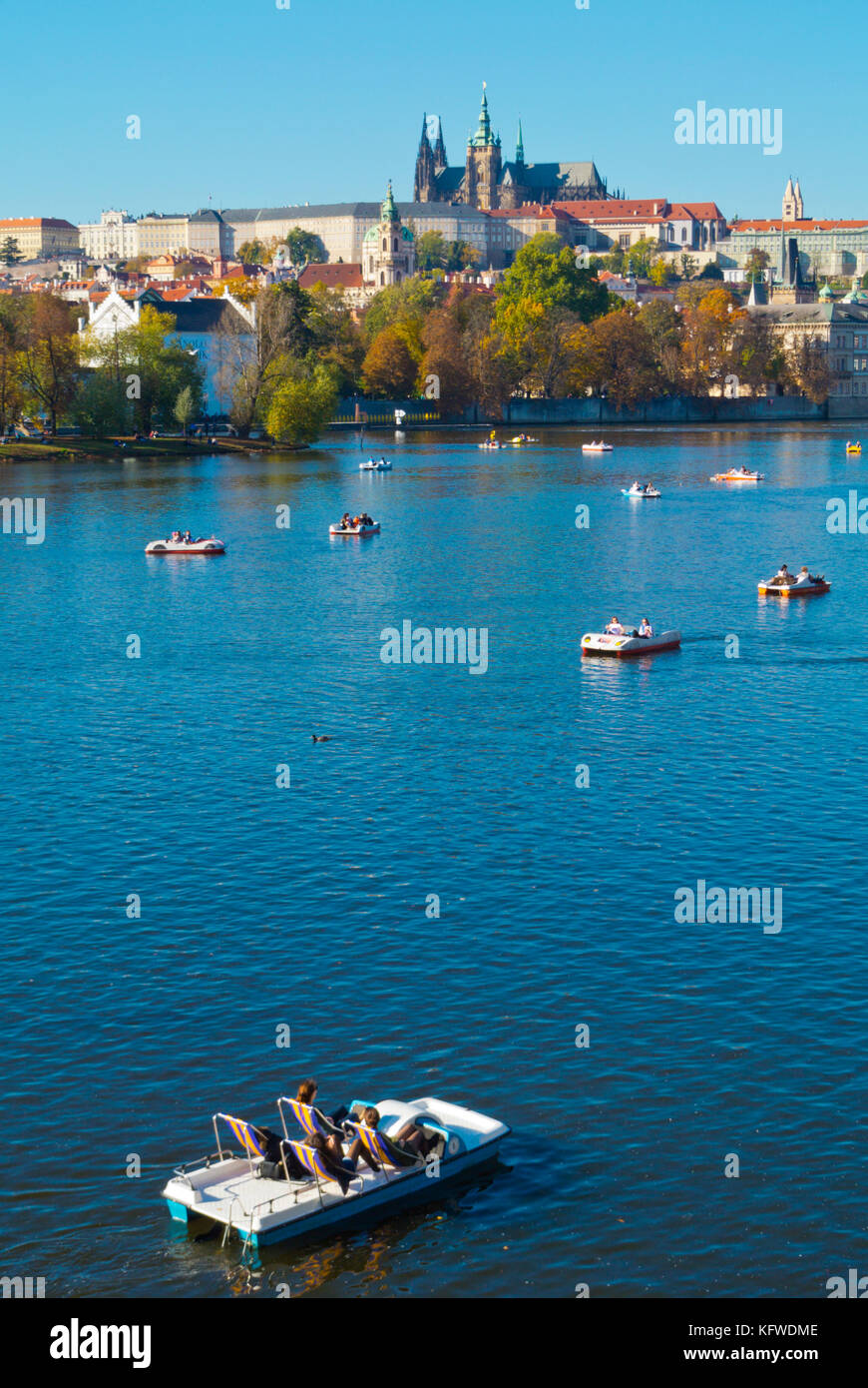 Pedalos and boats, Vltava River, in front of Mala Strana and Hrad the castle hill, Prague, Czech Republic Stock Photo