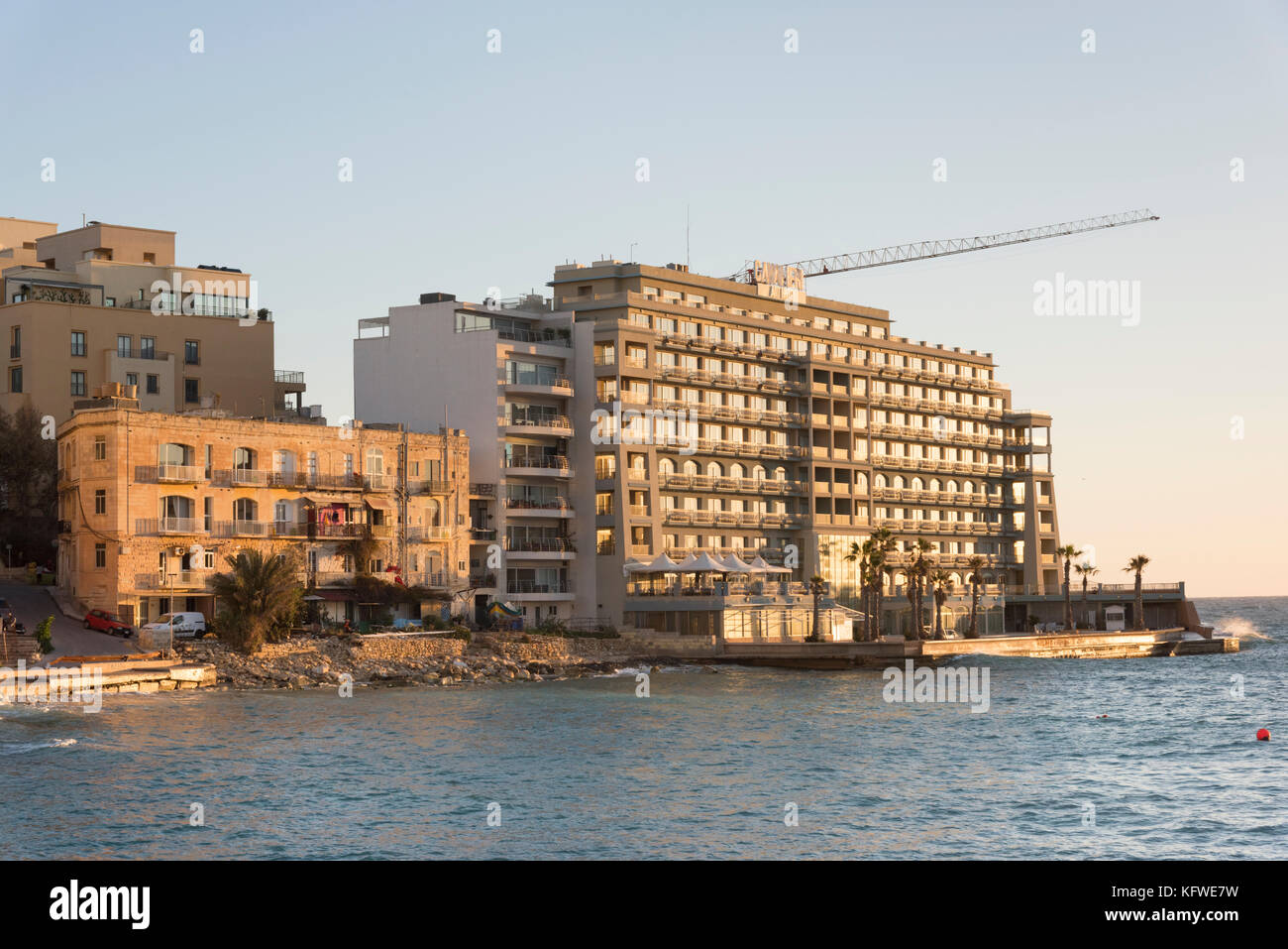 The Cavalieri Art Hotel at St Julians Bay Malta at dawn Stock Photo